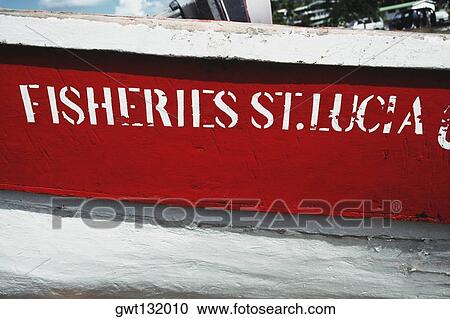 Side view of a fishing boat bearing a nameplate, St. Lucia View Large Photo Image Stock Image - Side view of a fishing boat bearing a nameplate, St. Lucia. Fotosearch