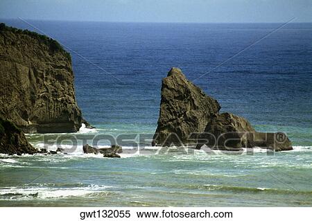 Side view of a gentle surf breaking on rocks on a seashore, St. Lucia, Caribbean View Large Photo Image Stock Photography - Side view of a gentle surf breaking on rocks on a seashore, St. Lucia, Caribbean. Fotosearch
