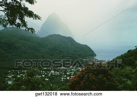 The Grand Piton on the island of St. Lucia is shrouded in mist View Large Photo Image Stock Photo - The Grand Piton on the island of St. Lucia is shrouded in mist. Fotosearch