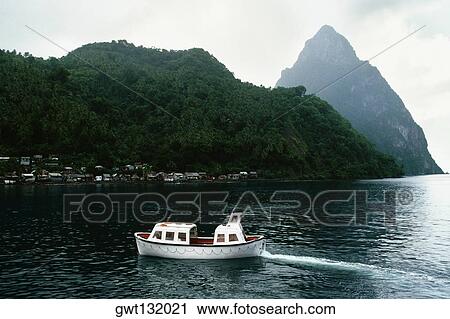 View of the Grand Piton Peak with a boat sailing in the foreground View Large Photo Image Stock Image - View of the Grand Piton Peak with a boat sailing in the foreground. Fotosearch