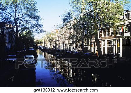 Boats in a canal, Amsterdam, Netherlands View Large Photo Image Stock Image - Boats in a canal, Amsterdam, Netherlands. Fotosearch