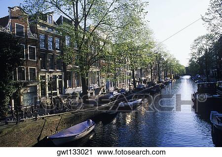 Boats in a canal, Amsterdam, Netherlands View Large Photo Image Stock Image - Boats in a canal, Amsterdam, Netherlands. Fotosearch