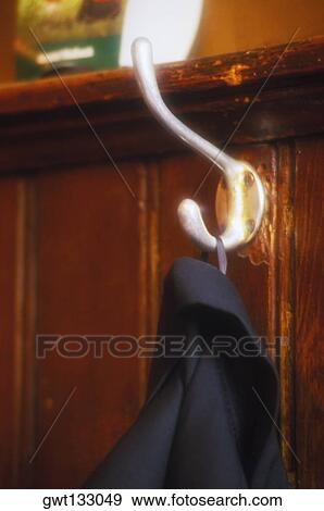 Close-up of a coat hanging on a hook View Large Photo Image Stock Photo - Close-up of a coat hanging on a hook. Fotosearch