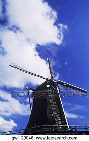 Low angle view of a traditional windmill, Amsterdam, Netherlands View Large Photo Image Stock Photograph - Low angle view of a traditional windmill, Amsterdam, Netherlands. Fotosearch
