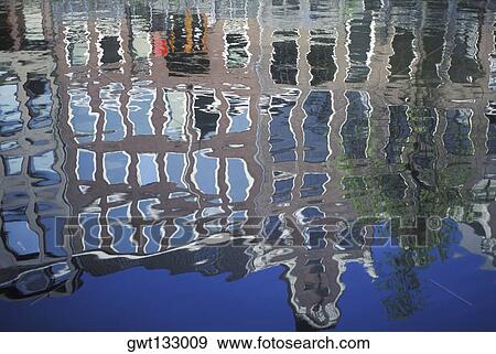 Reflection of buildings in water, Amsterdam, Netherlands View Large Photo Image Stock Photo - Reflection of buildings in water, Amsterdam, Netherlands. Fotosearch