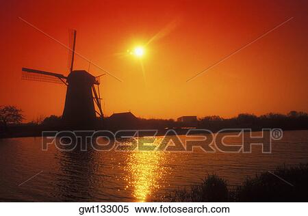 Silhouette of a traditional windmill at dusk, Amsterdam, Netherlands View Large Photo Image Stock Photography - Silhouette of a traditional windmill at dusk, Amsterdam, Netherlands. Fotosearch