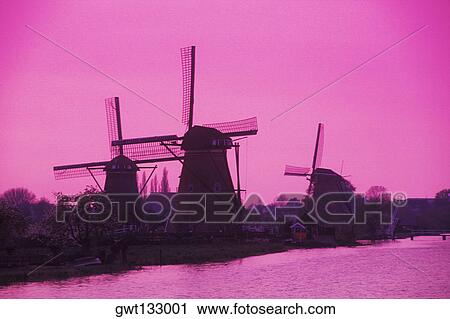 Silhouette of traditional windmills at dusk, Amsterdam, Netherlands View Large Photo Image Stock Image - Silhouette of traditional windmills at dusk, Amsterdam, Netherlands. Fotosearch