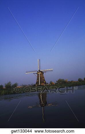 Traditional windmill near a pond, Amsterdam, Netherlands View Large Photo Image Picture - Traditional windmill near a pond, Amsterdam, Netherlands. Fotosearch