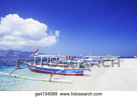 Boats moored on the beach, Bali, Indonesia View Large Photo Image Stock Photo - Boats moored on the beach, Bali, Indonesia. Fotosearch