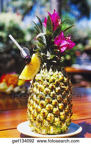 Stock Image - Close-up of a pineapple on a plate. Fotosearch