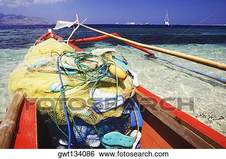 Fishing net in a boat, Bali, Indonesia View Large Photo Image Stock Photograph - Fishing net in a boat, Bali, Indonesia. Fotosearch