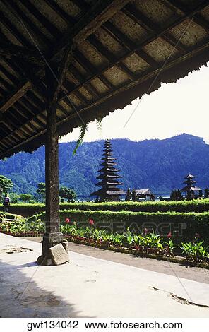 Stock Image - Hedge in front of a temple, Pura Ulu Danau Temple, Bali, Indonesia. Fotosearch