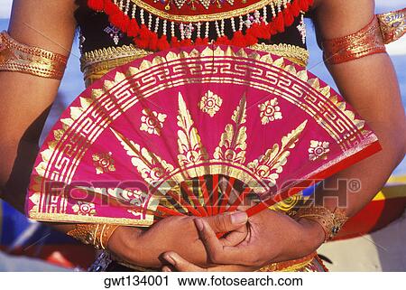 Mid section view of a woman holding a folding fan, Bali, Indonesia View Large Photo Image Stock Image - Mid section view of a woman holding a folding fan, Bali, Indonesia. Fotosearch