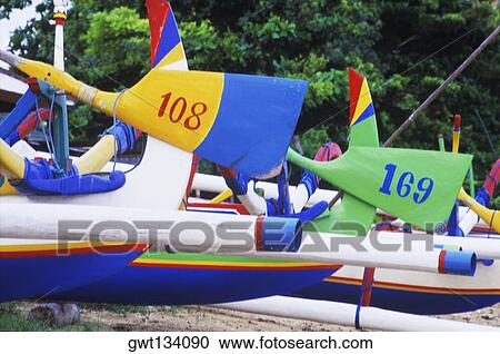 Stock Image - Numbers painted on oars, Bali, Indonesia. Fotosearch