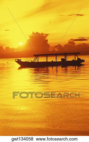 Silhouette of a boat in the sea, Bali, Indonesia View Large Photo Image Stock Photo - Silhouette of a boat in the sea, Bali, Indonesia. Fotosearch