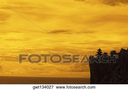 Silhouette of a pagoda on a cliff, Bali, Indonesia View Large Photo Image Stock Photo - Silhouette of a pagoda on a cliff, Bali, Indonesia. Fotosearch