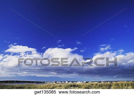 Stock Photography - Clouds over a landscape, Cape Cod, Massachusetts, USA . Fotosearch