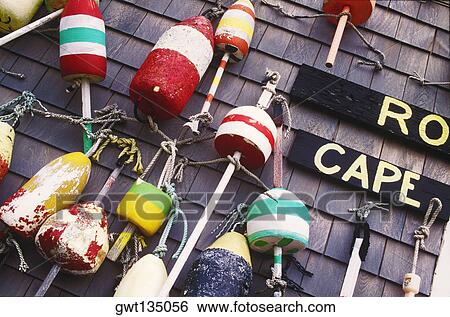 Group of fishing bobbers hanging on a wall View Large Photo Image Stock Photograph - Group of fishing bobbers hanging on a wall. Fotosearch
