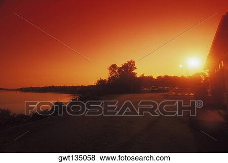 Panoramic view of a sunset over a lake, Cape Cod, Massachusetts, USA View Large Photo Image Stock Photo - Panoramic view of a sunset over a lake, Cape Cod, Massachusetts, USA . Fotosearch