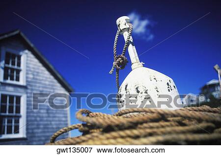 Rope tied up to an anchor View Large Photo Image Stock Photo - Rope tied up to an anchor. Fotosearch