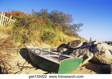 Rowboat near rocks on the beach, Cape Cod, Massachusetts, USA View Large Photo Image Stock Image - Rowboat near rocks on the beach, Cape Cod, Massachusetts, USA . Fotosearch
