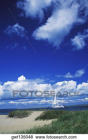 Stock Photo - Sailboat in a river, Cape Cod, Massachusetts, USA . Fotosearch