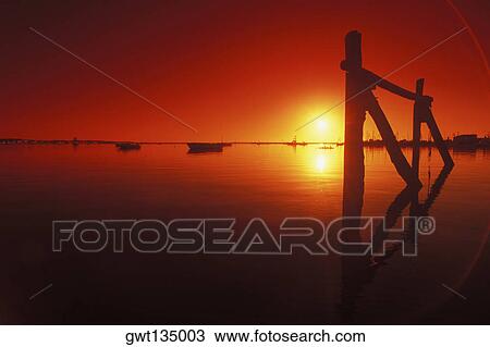 Stock Image - Sunset over a river, Cape Cod, Massachusetts, USA . Fotosearch