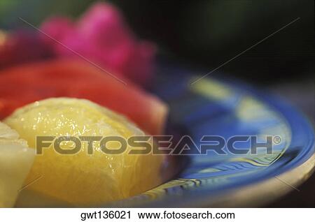 Close-up of a slice of tangerine on a plate View Large Photo Image Stock Image - Close-up of a slice of tangerine on a plate. Fotosearch
