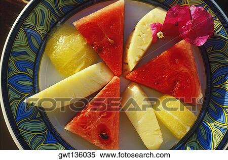 Close-up of fruit on a plate View Large Photo Image Stock Photography - Close-up of fruit on a plate. Fotosearch