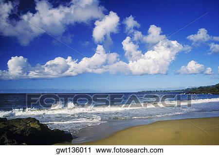 Stock Image - Cloudy sky over the sea, Caribbean. Fotosearch