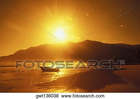 Stock Photo - Sun shining over hills. Fotosearch