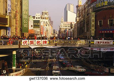 Crowd of people on a footbridge across a road, China View Large Photo Image Stock Photograph - Crowd of people on a footbridge across a road, China. Fotosearch