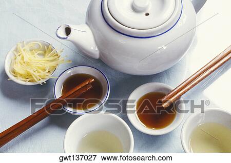High angle view of a teapot with tea in bowls and chopsticks View Large Photo Image Stock Photo - High angle view of a teapot with tea in bowls and chopsticks. Fotosearch