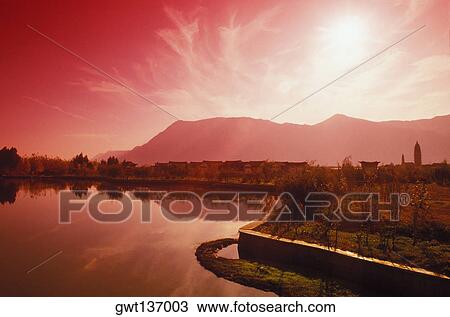 Stock Image - High angle view of a town at the lakeside, China. Fotosearch
