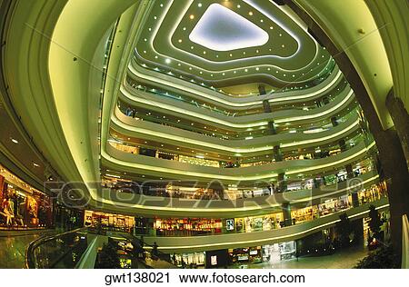 Stock Image - Interiors of a shopping mall, Hong Kong, China. Fotosearch