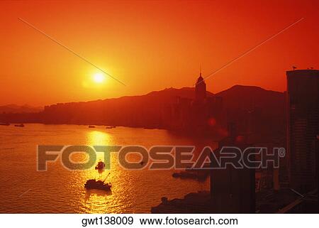 Stock Photo - Sunset over a mountain, Hong Kong, China. Fotosearch