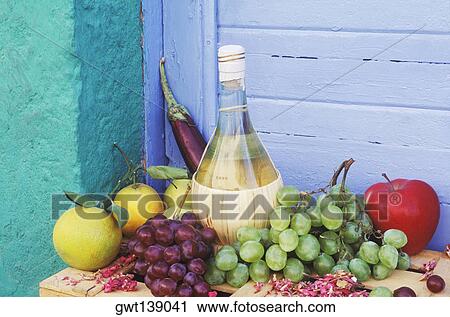 Close-up of a bottle with fruit on the table View Large Photo Image Stock Image - Close-up of a bottle with fruit on the table. Fotosearch