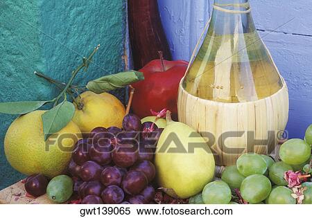Close-up of a bottle with fruit on the table View Large Photo Image Stock Photography - Close-up of a bottle with fruit on the table. Fotosearch
