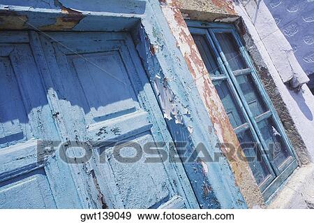 Close-up of the closed door and a window of a house View Large Photo Image Stock Photo - Close-up of the closed door and a window of a house. Fotosearch