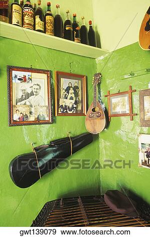 Guitar with picture frames hanging on a wall in a bar View Large Photo Image Stock Photo - Guitar with picture frames hanging on a wall in a bar. Fotosearch