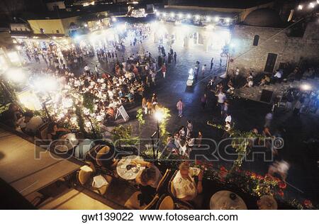 High angle view of a group of people in a market View Large Photo Image Stock Image - High angle view of a group of people in a market. Fotosearch