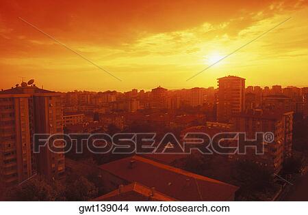 High angle view of buildings in a city at dusk View Large Photo Image Picture - High angle view of buildings in a city at dusk. Fotosearch