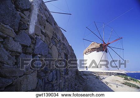 Picture - Traditional windmill on the beach. Fotosearch