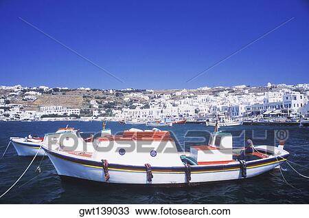 Two fishing boats moored in the sea View Large Photo Image Stock Image - Two fishing boats moored in the sea. Fotosearch