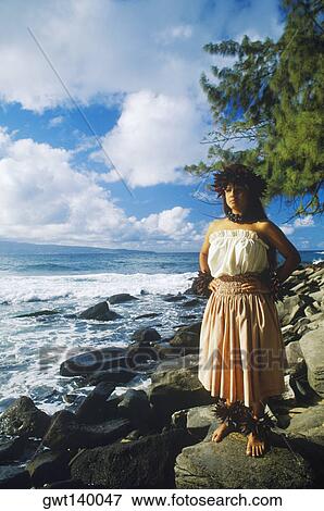 Hula dancer standing on the beach with arms akimbo, Hawaii, USA View Large Photo Image Stock Photo - Hula dancer standing on the beach with arms akimbo, Hawaii, USA. Fotosearch