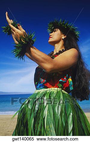 Low angle view of a hula dancer dancing on the beach, Hawaii, USA View Large Photo Image Stock Photography - Low angle view of a hula dancer dancing on the beach, Hawaii, USA. Fotosearch