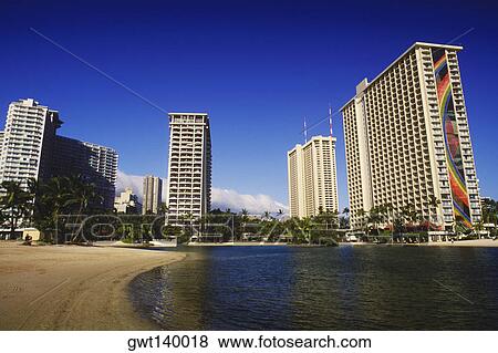 Low angle view of skyscrapers at the waterfront, Hawaii, USA View Large Photo Image Stock Photo - Low angle view of skyscrapers at the waterfront, Hawaii, USA. Fotosearch