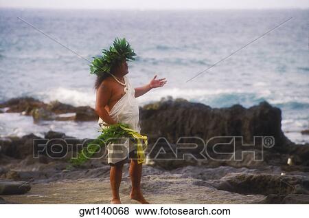Stock Photo - Side profile of a mid adult man standing on the beach. Fotosearch