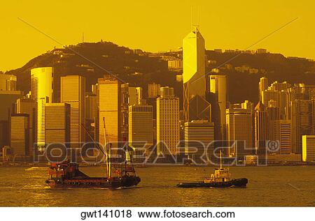 Boats in the sea in front of skyscrapers, Hong Kong, China View Large Photo Image Stock Photo - Boats in the sea in front of skyscrapers, Hong Kong, China. Fotosearch