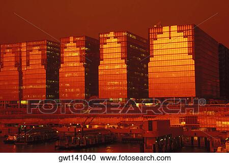 Stock Image - Buildings at the waterfront, Hong Kong, China. Fotosearch